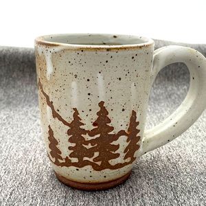 Custom thrown and decorated coffee mug.